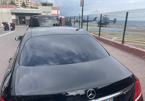 A driver from VIP Only Transfers waits for passengers in front of the helicopter airport in Monaco